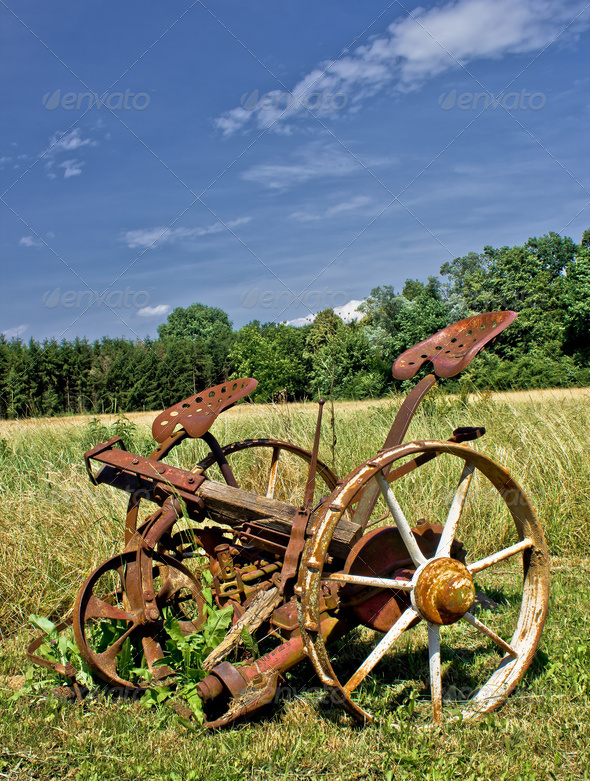 Traditional rusty horse powered grass mower & haymaker - Stock Photo - Images