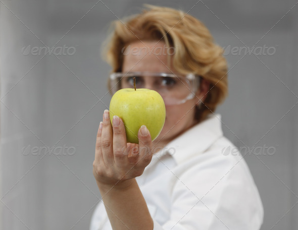 Researcher Offering an Apple - Stock Photo - Images