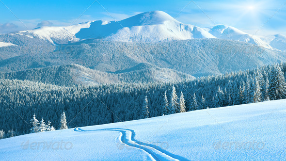 Winter mountain panorama with ski track - Stock Photo - Images