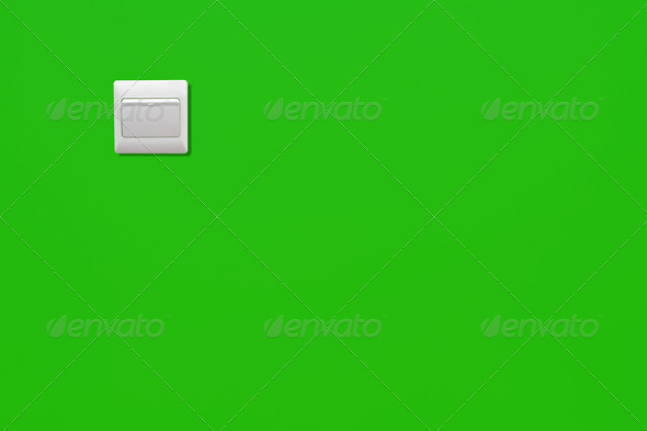 White power switch on a green wall of an energy saving room - Stock Photo - Images