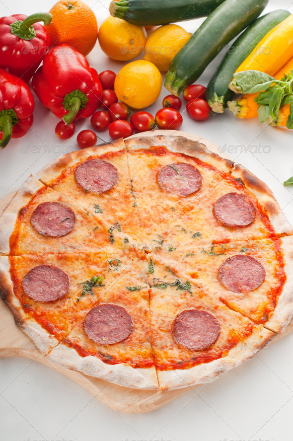 Italian original thin crust pepperoni pizza - Stock Photo - Images