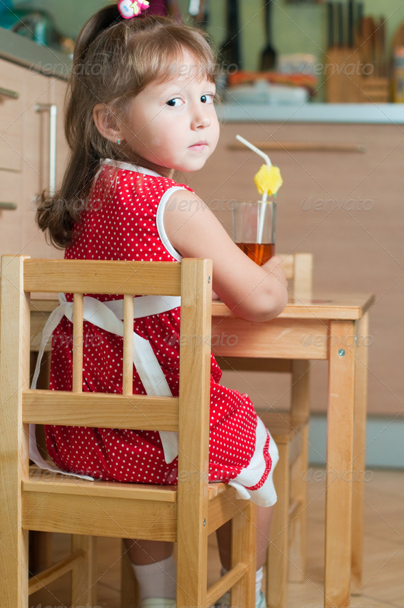 Royalty Free Stock Photography : a little girl at a table Photodune 1204397 Royalty Free Stock Photography : a little girl at a table Photodune 1204397