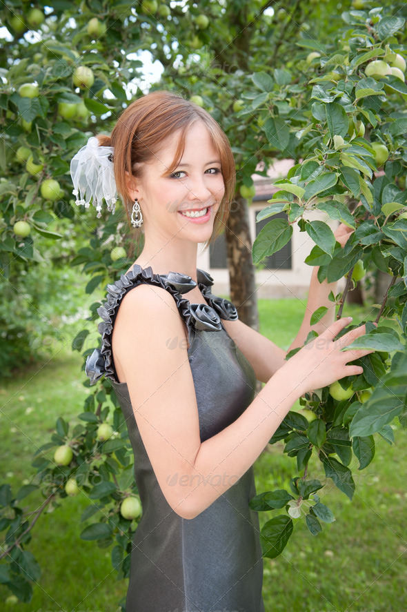 Portrait of a beautiful woman in elegant dress - Stock Photo - Images