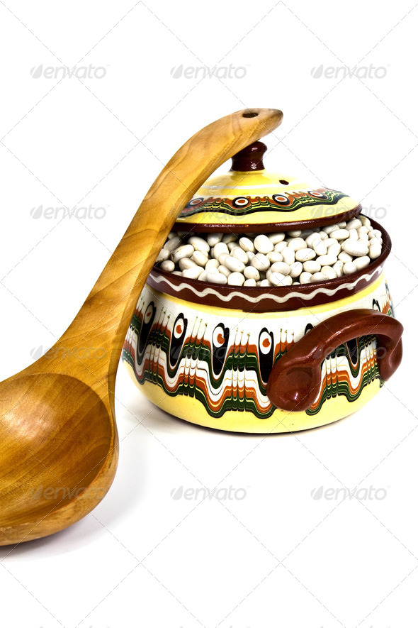 Wooden Spoon and colorful ceramic pot - Stock Photo - Images