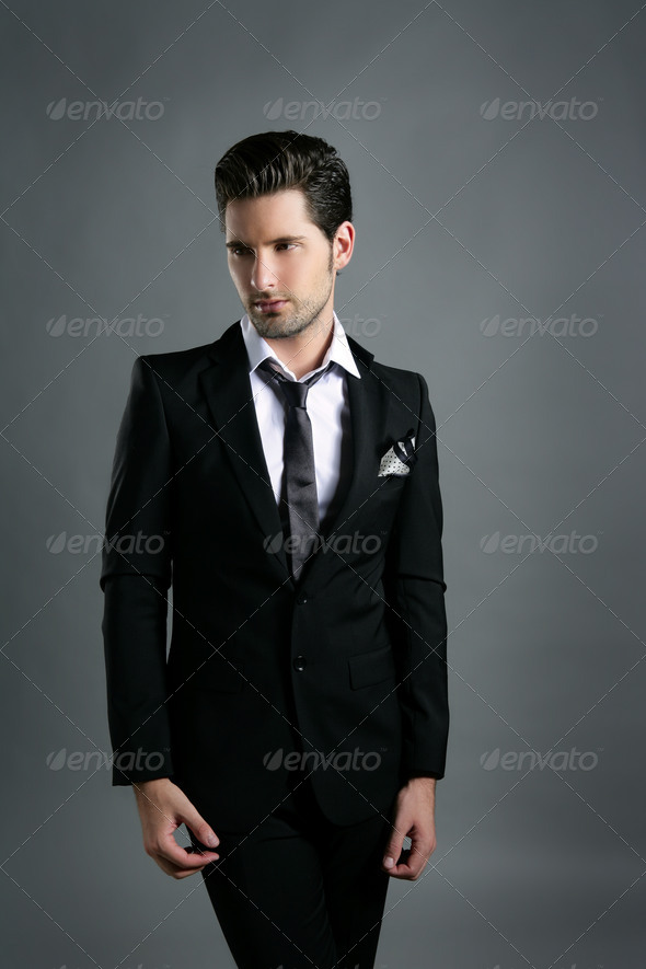 Fashion young businessman black suit casual tie - Stock Photo - Images