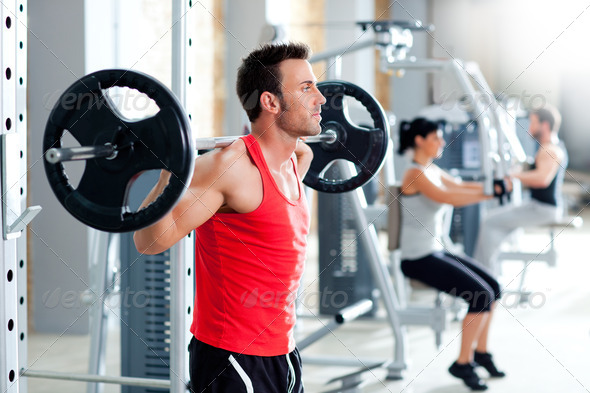 man with dumbbell weight training equipment gym - Stock Photo - Images