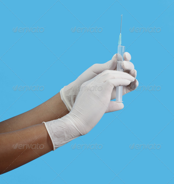 Hands Preparing an Injection - Stock Photo - Images