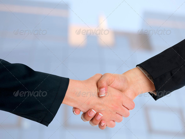 Architectural Handshaking in front of building - Stock Photo - Images