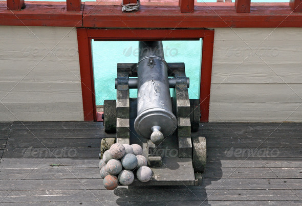 cannon with balls in a ship of Pirates of the Caribbean - Stock Photo - Images