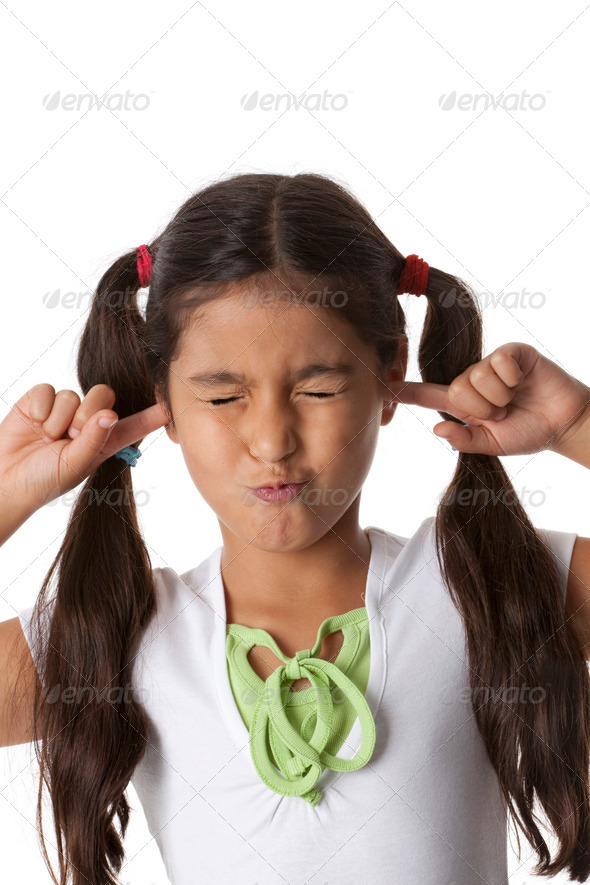 Little girl is closing her ears with her fingers - Stock Photo - Images