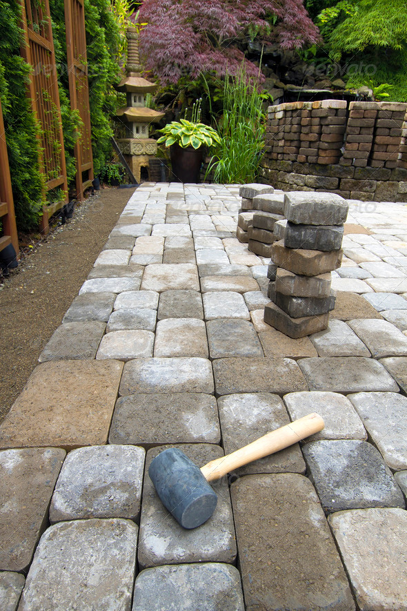 Laying Garden Pavers Patio - Stock Photo - Images