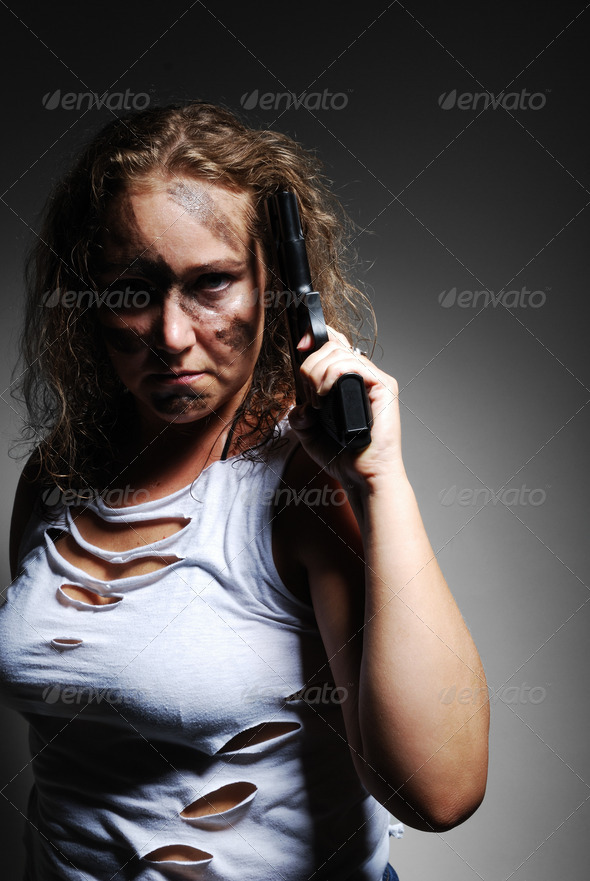 Serious woman with handgun - Stock Photo - Images