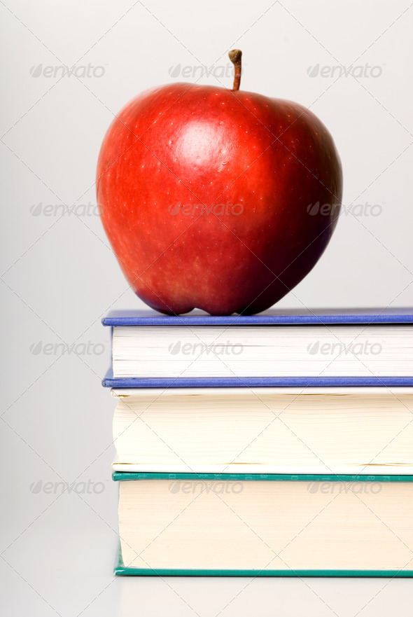 red apple to give to teacher with books