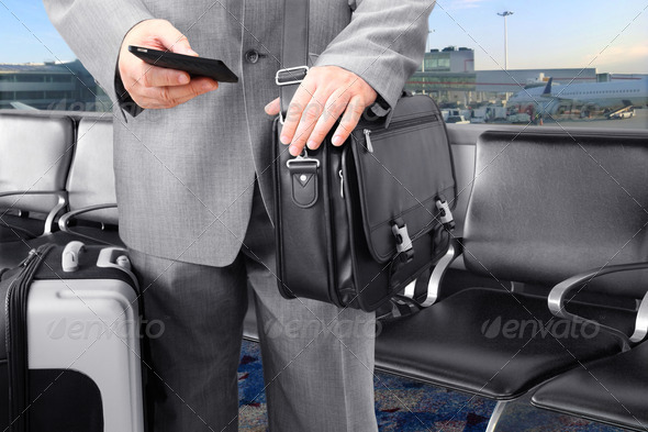 Traveling Businessman Calling by Phone at the Airport - Stock Photo - Images