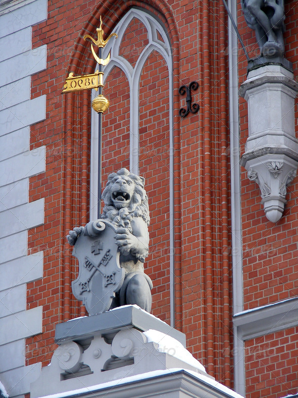 Lion holding shield - Stock Photo - Images