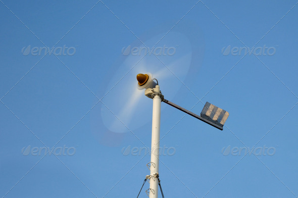 Spinning mini wind turbine on blue sky at Phuket, Thailand. - Stock Photo - Images