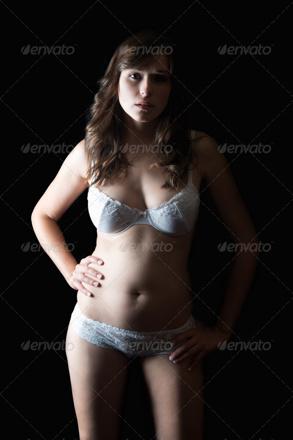 Portrait of a young woman in beautiful white underwear - Stock Photo - Images