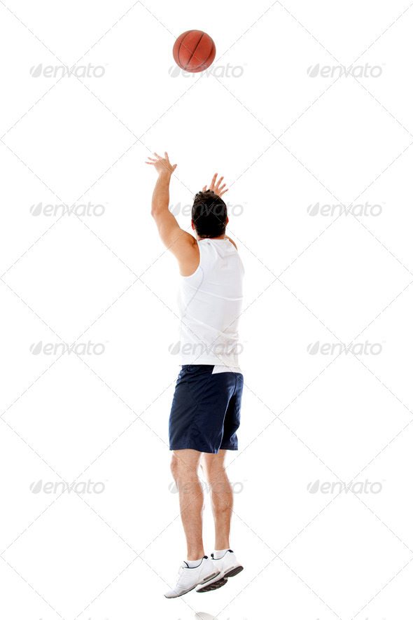Basketball player throwing the ball - Stock Photo - Images