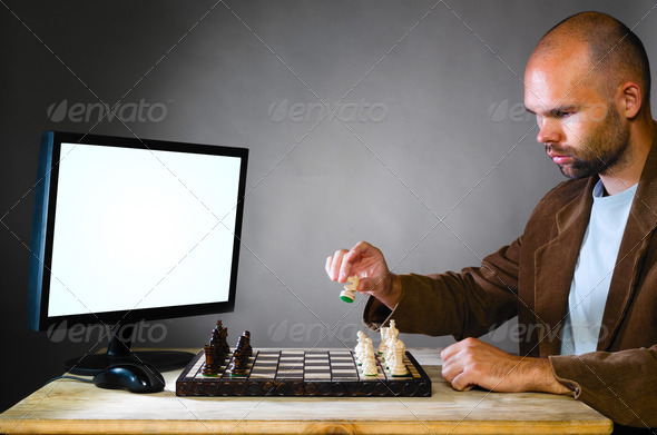 human chess player against computer - Stock Photo - Images