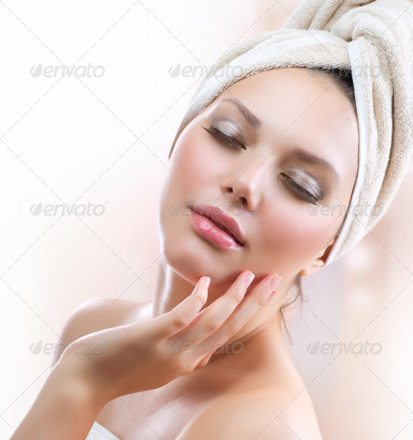 Spa Girl. Beautiful Young Woman After Bath Touching Her Face - Stock Photo - Images