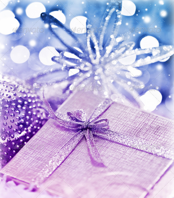 Purple blue Christmas gift with baubles decorations - Stock Photo - Images