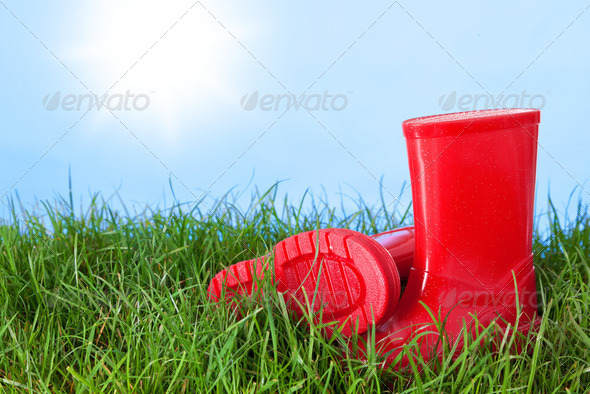 Childrens wellington boots outdoors on a sunny day. - Stock Photo - Images