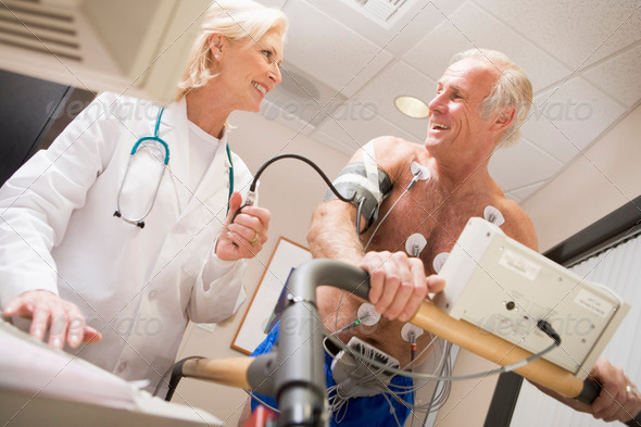 Stock Photo - PhotoDune Doctor Monitoring The Heart-Rate Of Patient On A Treadmill 335035 Stock Photo - PhotoDune Doctor Monitoring The Heart-Rate Of Patient On A Treadmill 335035