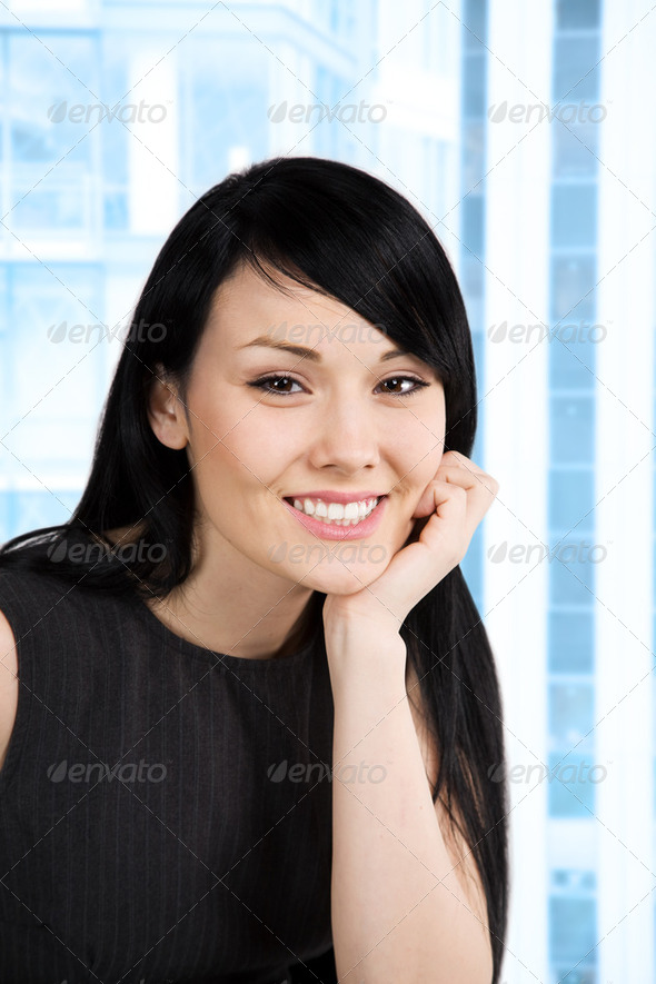 A shot of a beautiful smiling businesswoman in the office