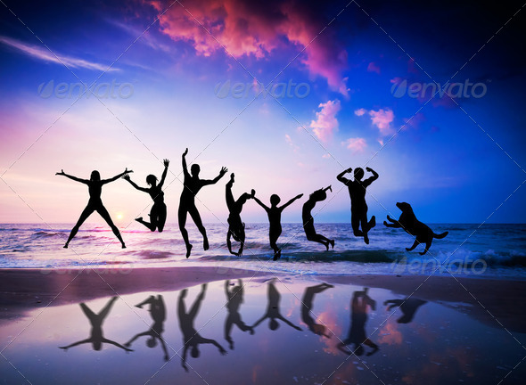 People and dog jumping on the beach. Happiness - Stock Photo - Images