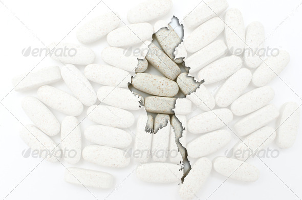 Outline map of myanmar with pills in the background for health a - Stock Photo - Images