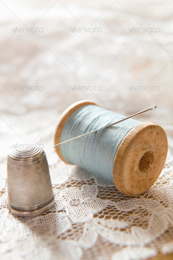 Vintage Cotton Reel With Needle And Silver Thimble On Lace - Stock Photo - Images