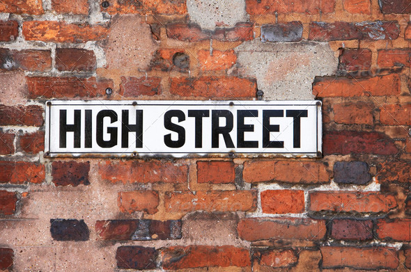 Rusty Metal High Street Road Sign On Brick Wall - Stock Photo - Images