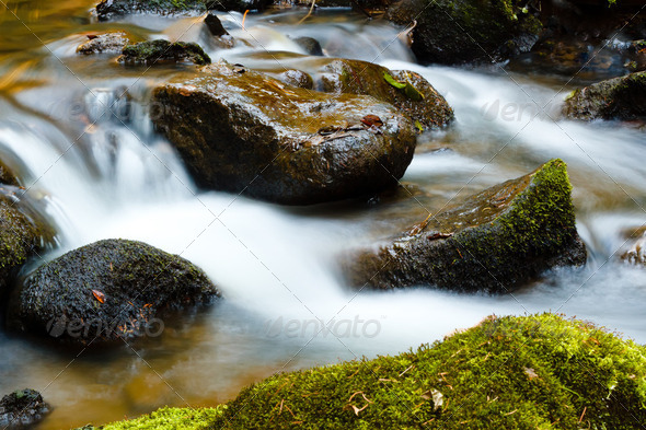 Falls on the small mountain river in a wood shooted in autumn - Stock Photo - Images