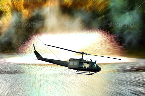 Army Helicopter in Combat Mission with Explosions - Stock Photo - Images