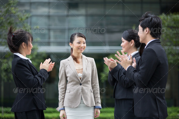 Asian business team congratulate a colleague. - Stock Photo - Images