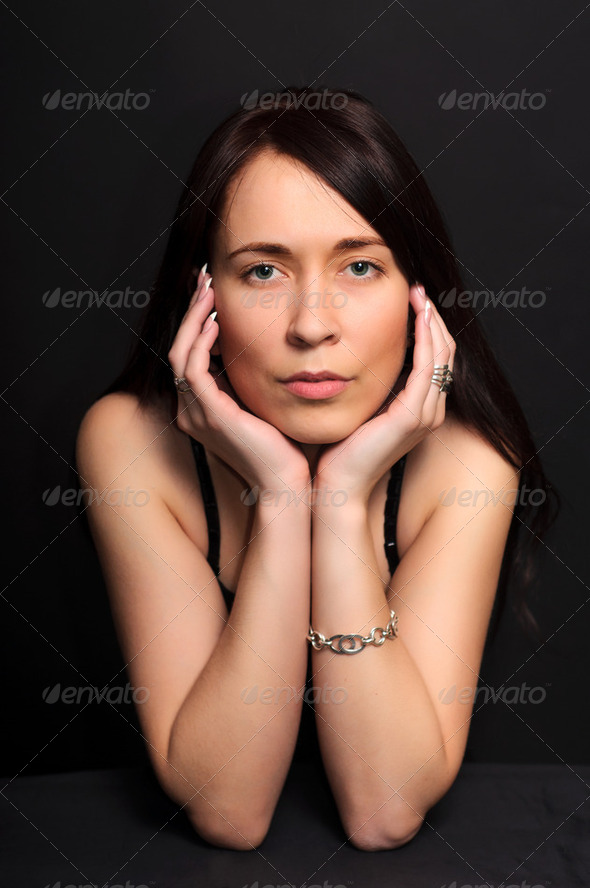 portrait brunette woman on black background - Stock Photo - Images