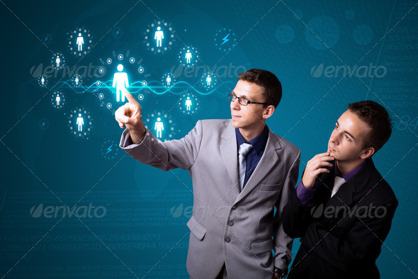 Businessman pressing modern social type of icons - Stock Photo - Images