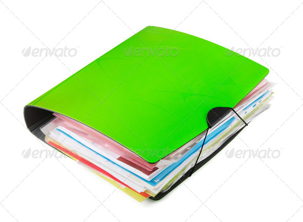 Green ring binder with documents isolated on white