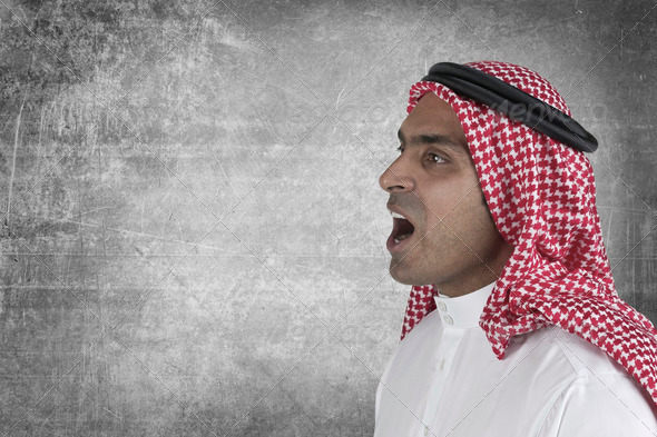 Young arabian man speaking with space to add suitable text - Stock Photo - Images