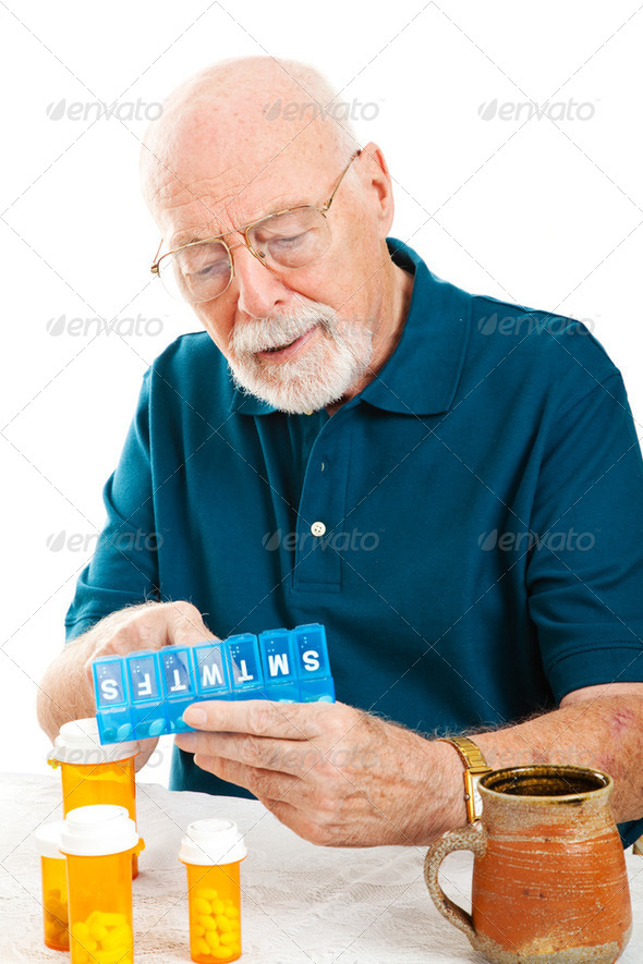 Senior Man Sorting Pills - Stock Photo - Images