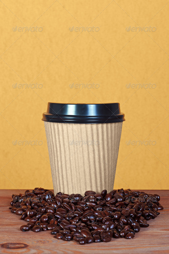 Takeaway paper coffee cup with beans - Stock Photo - Images