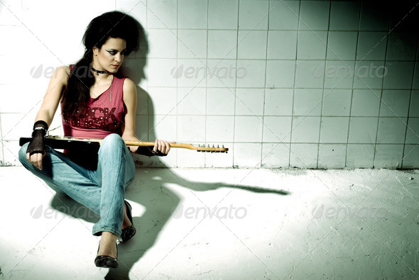 Female playing electric guitar - Stock Photo - Images