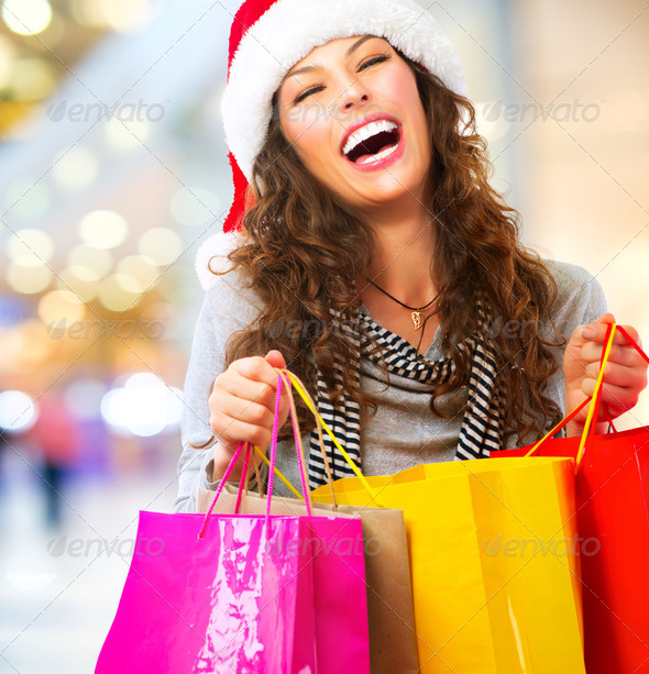 Christmas Shopping. Woman with Bags in Shopping Mall. Sales - Stock Photo - Images