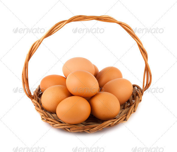 Brown chicken eggs on wicker basket - Stock Photo - Images