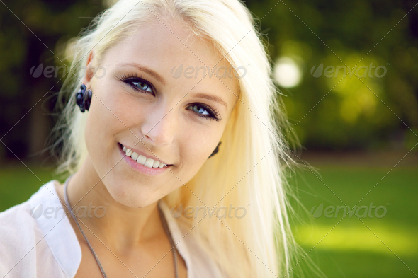 Portrait of blonde young woman outdoors - Stock Photo - Images