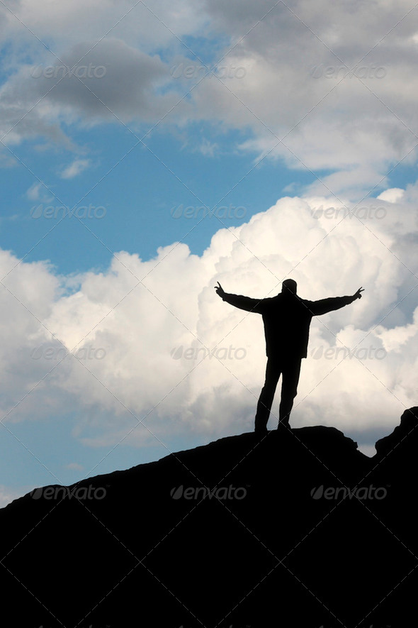 silhouette of a man in front of the blue sky - Stock Photo - Images