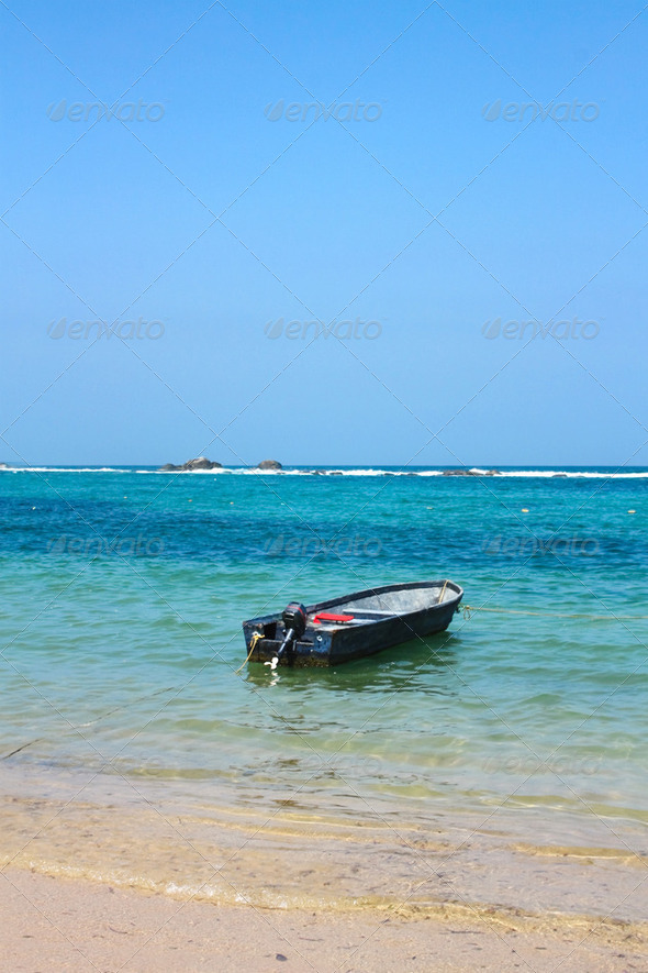 Boat in caribbean beach. Tayrona National Park. Colombia - Stock Photo - Images