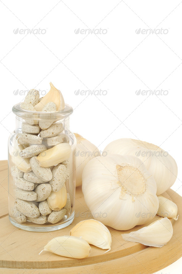 Garlic and herbal supplement pills isolated, alternative medicine concept - Stock Photo - Images