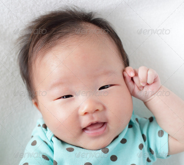 smile face close up of a cute baby - Stock Photo - Images