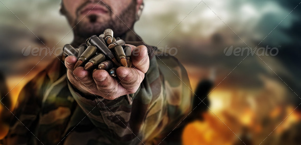 army war concept , military warrior with a handful of bullets ag - Stock Photo - Images